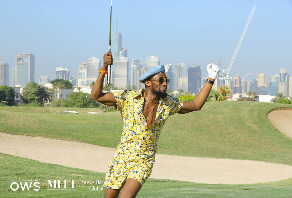 Golfer in jumpsuit celebrating